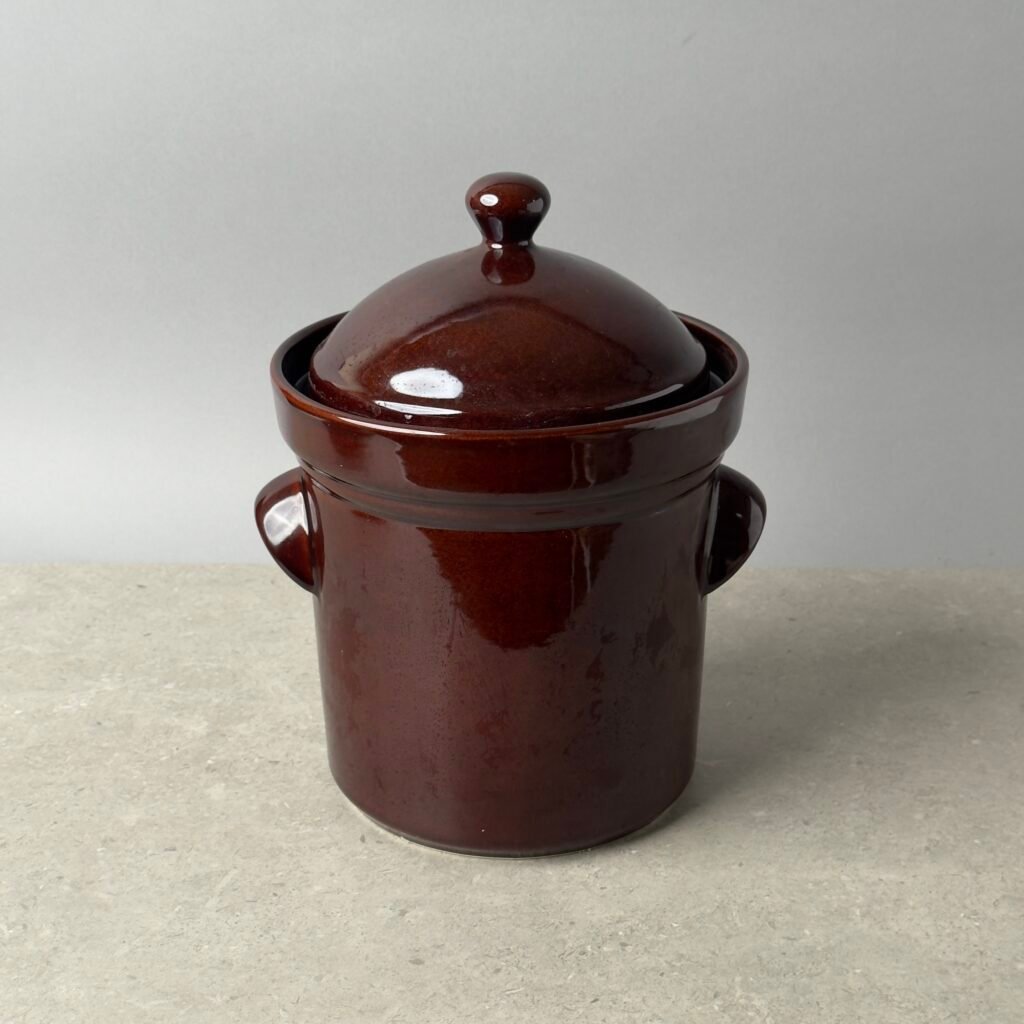Stone Creek Trading 5L fermentation crock with lid in brown ceramic on a neutral background