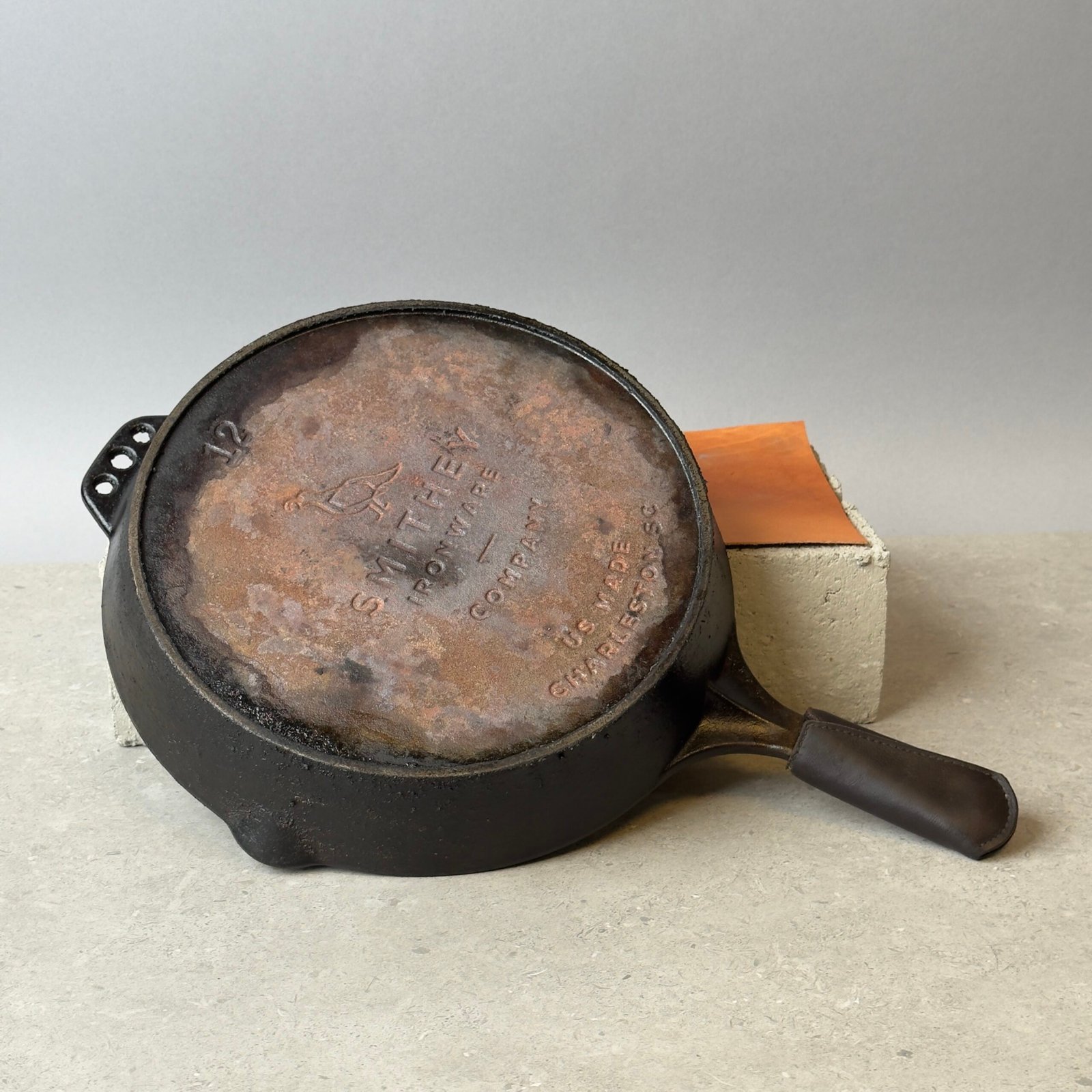 Smithey No 12 cast iron skillet bottom view showing engraved branding and made in USA marking